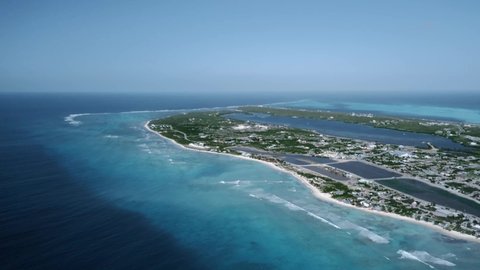 Drone panorama of Caribbean island, ocean and the bay, aerial video from Cockburn Town, Grand Turk, Turks and Caicos
