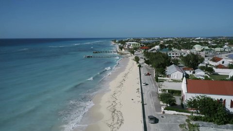 Drone footage of Cockburn Town waterfront, aerial video of embankment and two piers on Grand Turk, Turks and Caicos
