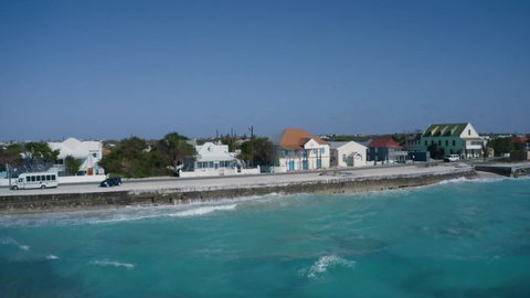 Drone camera flies off coastal houses in Cockburn Town, aerial video from tropical island of Grand Turk, Turks and Caicos
