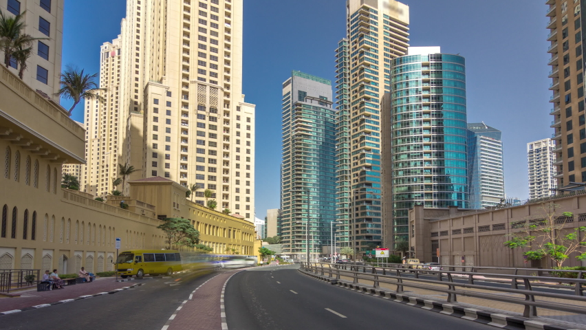 Traffic on the street at Jumeirah Beach Residence and Dubai marina timelapse hyperlapse with skyscrapers, United Arab Emirates. JBR is the largest single phase residential development | Shutterstock HD Video #1090486577