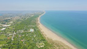 Inscription on video. Venice, Italy. Beaches of Punta Sabbioni. Cavallino-Treporti. Clear sunny weather. Multicolored text appears and disappears, Aerial View