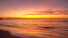 Tropical sea at sunset or sunrise over sea video 4K, The sun touches horizon, Red sky in golden hour amazing seascape,Ocean beach sunsets beautiful sky.Golden sky over sea beach