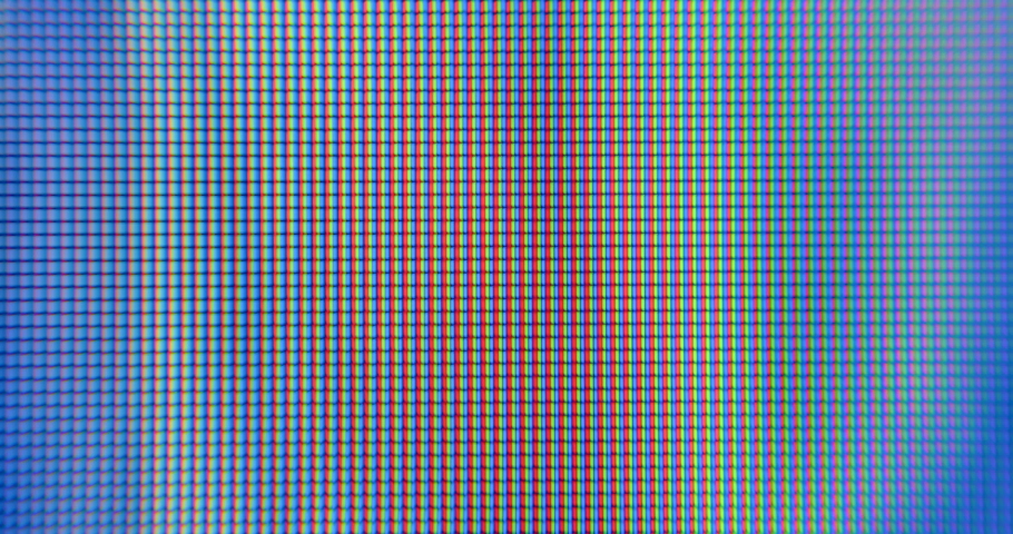 Macro pixels Quick change of color palette without borders. The movement of blue fire on the pixels of the monitor in macro. Dynamic video effect. Interframe transition.  | Shutterstock HD Video #1090497093