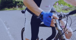 Animation of connections with arrows over legs of caucasian male biker. sport, active lifestyle, competition and technology concept digitally generated video.
