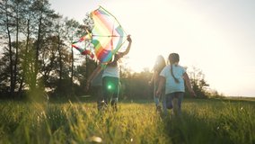 Happy family in park with dog run kite. Family picnic on green grass with pet. People play with kite in meadow in summer. Children with parents freedom and active lifestyle Family in nature dog play - Powered by Shutterstock - Get 15% off with code: PIKWIZARD15