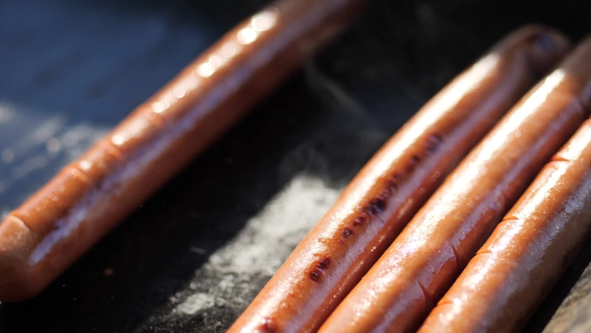 fried sausages hot dog sausages Royalty-Free Stock Footage #1090499313