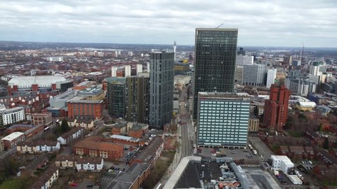 BIRMINGHAM, UK - 2022: Establishing aerial view of Birmingham city centre UK between large buildings 