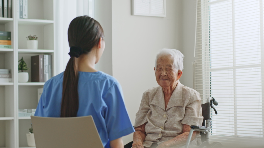 Young Asian woman nurse, caregiver assist a senior Asian woman to do physical therapy and exercise at home, nursing home concept Royalty-Free Stock Footage #1090500677