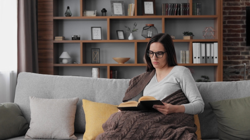Young woman taking off eyeglasses feeling eye strain.Tired woman with closed eyes massaging eyes having painful sensations.Migraine, head ache, bad vision, chronic fatigue and eyestrain concept. Royalty-Free Stock Footage #1090507839