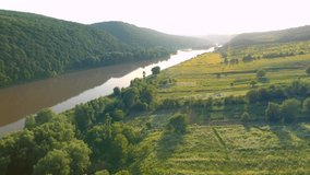 Amazing view of the grand river and green valley. Footage from a bird's eye view. Location place Dniester River, Ukraine, Europe. Cinematic drone shot. Filmed in UHD 4k video. Beauty earth.