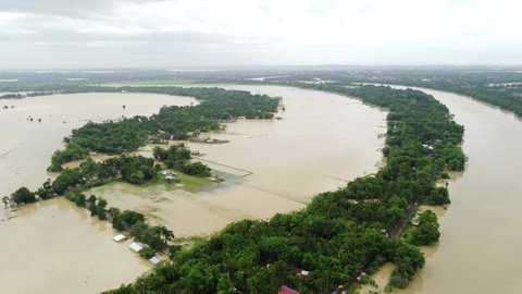 Aerial view of small town been Flooded countryside neighbourhood in Silchar, Assam India Barak River at 19 May 2022 Homes, houses overflowing muddy water concept of nature disaster climate change 4k f