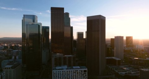 City of Los Angeles with skyscrapers skyline aerial view at sunset aerial flying with drone.