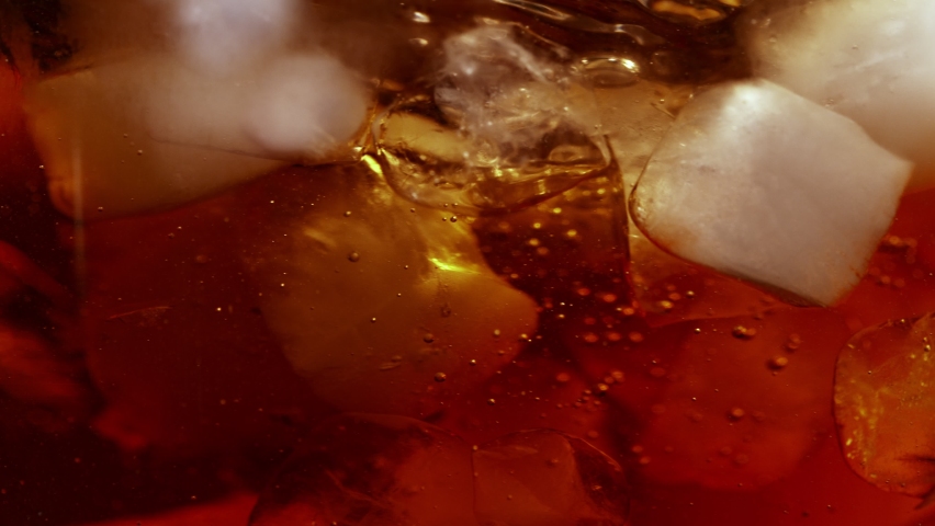 Super Slow Motion Shot of Pouring Cream or Milk into Ice Coffee Whirl at 1000fps. Royalty-Free Stock Footage #1090525167