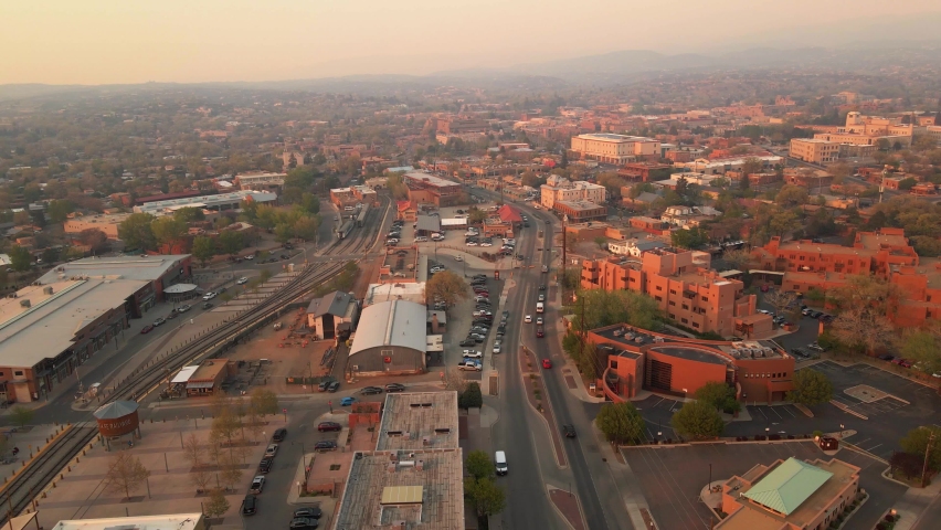 Aerial view overlooking the city of Santa Fe, covered in wildfire smoke haze, in New Mexico, USA - circling, drone shot