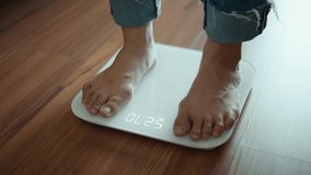 B roll - Woman Feet Standing Weighing Scales, Female Checking BMI Weight Loss. Barefoot Measuring Body Fat Overweight - Powered by Shutterstock - Get 15% off with code: PIKWIZARD15
