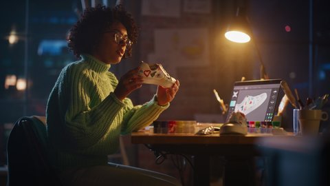 Cinematic Shot of Multiethnic Woman Enjoying of Her Work while Creating Hand Craft Shoe Late at Evening. Colorful Wild Brave Design of Sneakers Concept. Slow Motion