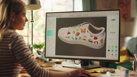Progressive Teen Female Designer Choose Colours and Patterns while Modelling 3D Shoe at her Professional Desktop Computer. Woman Creating, Designing a New 3D Model in CAD Program. Freelance Work