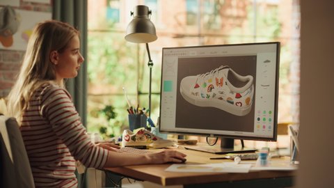 Blonde Teen Woman Creating and Rendering 3D Model of Unique Sneaker at Big Desktop Computer during Work in Home Office. Freelance and Millennial People Concept