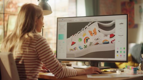 Young Female Designer Rotate 3d Model of Shoe while Working at New Project on Desktop Computer at Desk in Creative Office. Girl Satisfied of her Work. Graphic Designer Concept