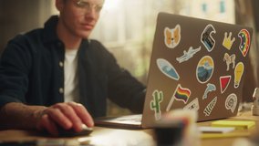 Focused Male Software Engineer Codding on Laptop Computer while Working with Inspiration in Modern Loft Flat. Modern Man Creating Something New. Modern Freelancer at Remote Work Concept - Powered by Shutterstock - Get 15% off with code: PIKWIZARD15