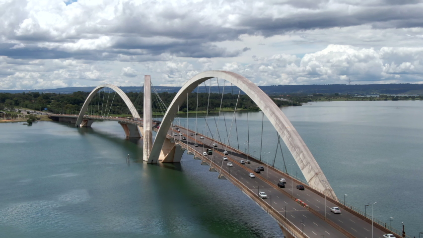 Aerial view of traffic on JK Bridge (Portuguese: Ponte JK ), a steel and concrete arch bridge across Lake Paranoa in Brasilia, Federal District, capital of Brazil.