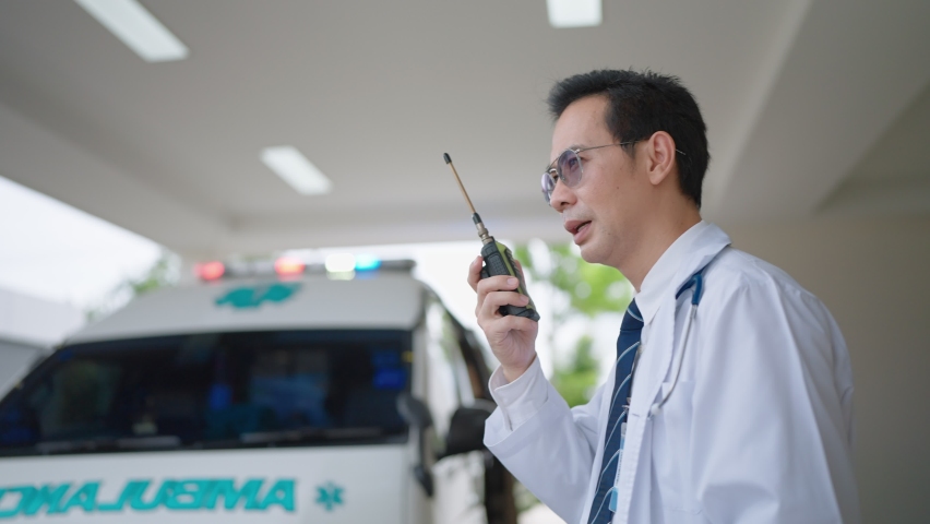 Paramedic using a radio to report an emergency Royalty-Free Stock Footage #1090534459