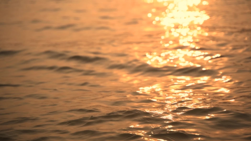 Reflection of sunlight over Ganges river surface in slow motion at Varanasi India | Shutterstock HD Video #1090536777
