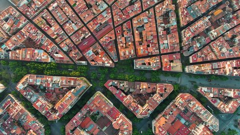 Aerial view of Barcelona Eixample residential district and old town narrow streets, gothic quarter at sunrise. Catalonia, Spain