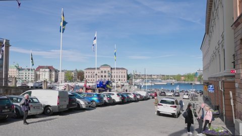 Beautiful view of Swedish and Finnish flags at royalty place of Stockholm. Sweden. Stockholm. 05.18.2022.