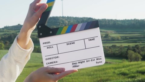 Clapperboard close-up. Movie clapper on nature background. Film production, cinematography concept. 
