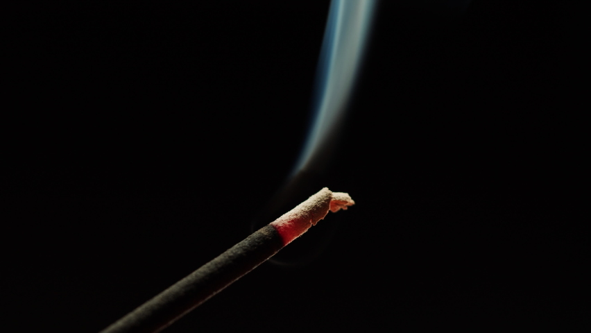 Aromatherapy, burning incense stick close-up. Indian aroma sticks. Meditation, spa relax concept. | Shutterstock HD Video #1090550821