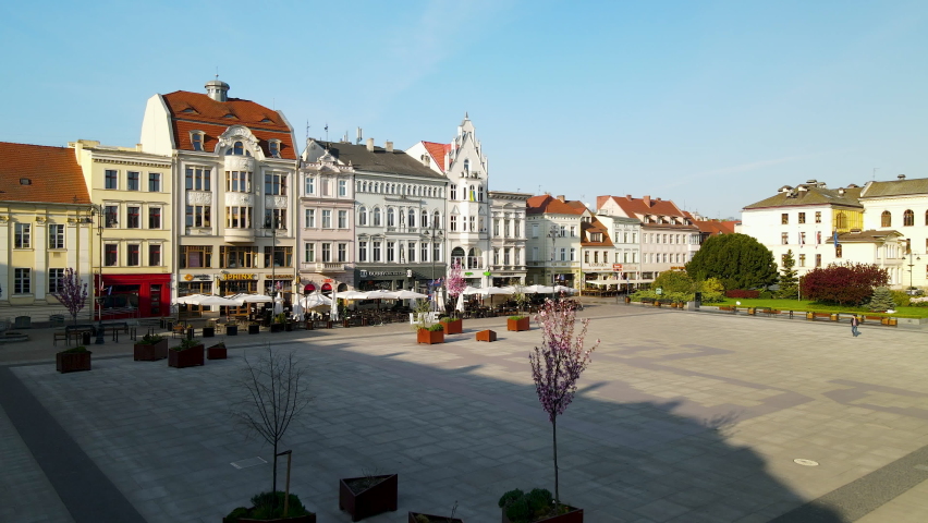 Colorful And Modern Building Structures Of The Stary Rynek Central Square In Bydgoszcz City, Poland. Forward Aerial