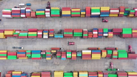 distribution warehouse at industrial factory with container for logistic import and export business aerial top view camera up from drone 4k video