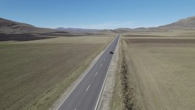 Long Highway Across Rural Fields. Road. Highway. Way. Freeway. Aerial Video. Landscape. Cars on the Highway.