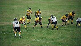 American Football Teams Start Game: Professional Players, Aggressive Face-off, Tackle, Pass, Fight for Ball and Score. Warrior Competition Full of Brutal Energy, Power, Skill. Slow Motion Wide Shot - Powered by Shutterstock - Get 15% off with code: PIKWIZARD15