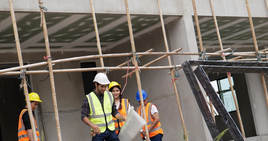Four civil engineers leave the building.