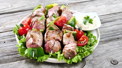 grilled barbecue beef skewer and sauce