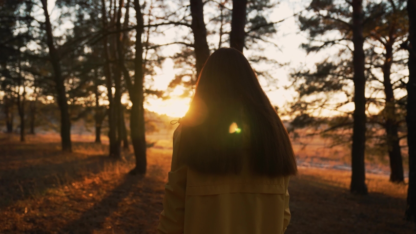Girl walks through natural forest. Woman hiking alone. Teenager girl in nature at sunset. Fantasy of people in park in autumn. Active lifestyle. People in forest. Tourist walk in autumn forest park | Shutterstock HD Video #1090570667
