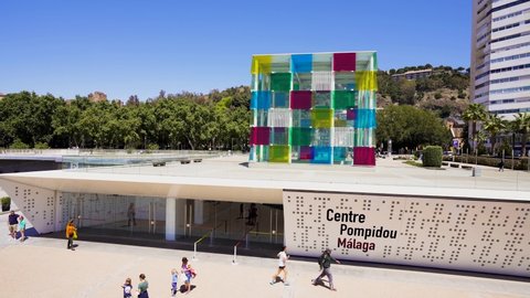 Malaga, SPAIN - April 21 2022: Pompidou Centre building known as The Cube, situated between Docks 1 and 2 of the port of Malaga. A privileged location in front of the waters of the bay of Malaga.