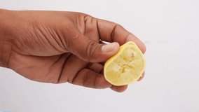 Crushing lemon and dropping lemon juice, Lemon juice footage
