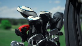 Professional sport golf clubs in bag outside. Putter equipment in golfing cart close up. Golfers tools set in driving buggy car on tournament game country club. Activity sunny summer day concept. - Powered by Shutterstock - Get 15% off with code: PIKWIZARD15