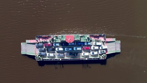 top down view of ferryboat sailing. Ferryboat transferring cars. Ferry transfers cars and passengers to the other side