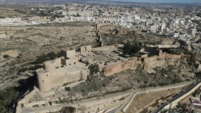 Alcazaba of Almeria with sea coast in background, Andalusia in Spain. Aerial circling