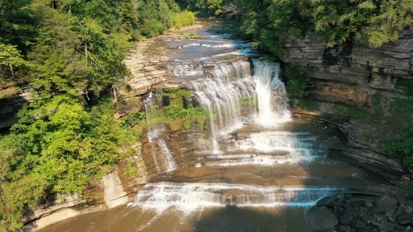 Cummins Falls Flowing Into The River With Verdant Forest In Tennessee, Nashville. - aerial