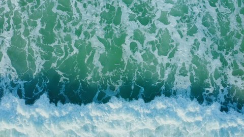 Aerial view of clear turquoise sea and waves, Top view of Clear turquoise sea water wave foam and tide texture, Beautiful Drone View of the Ocean Waves Splashing, Clear turquoise sea water pattern