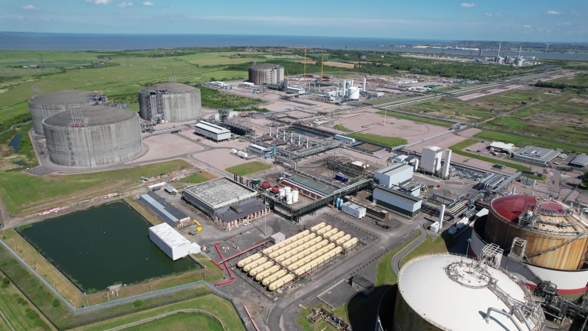 National grid Grain LNG Terminal gas storage tanks Kent UK drone aerial view Royalty-Free Stock Footage #1090597185