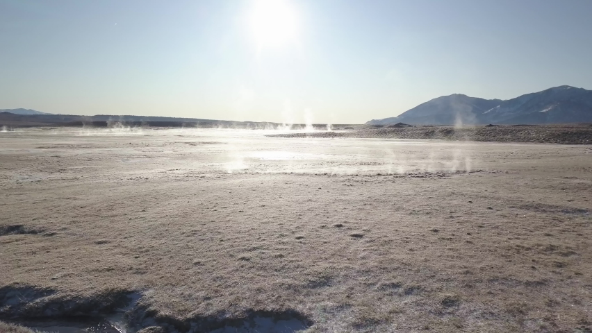 Aerial View Person in Mammoth Lakes Hot Springs Land by Road on Sunny Winter Day. Revealing Drone Shot