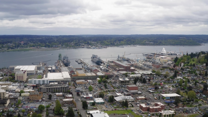 Panoramic Cityscape Of Bremerton In Washington State Overlooking The Puget Sound Naval Shipyard, United States. Aerial Descend