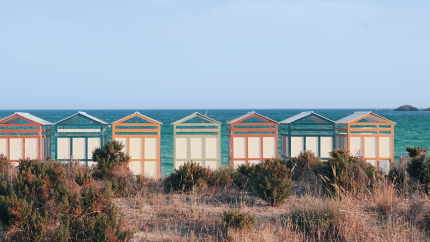 Famous beach huts in Sagaro with Playa de Sant Pol, Costa Brava. Spain. Mediterranean Sea