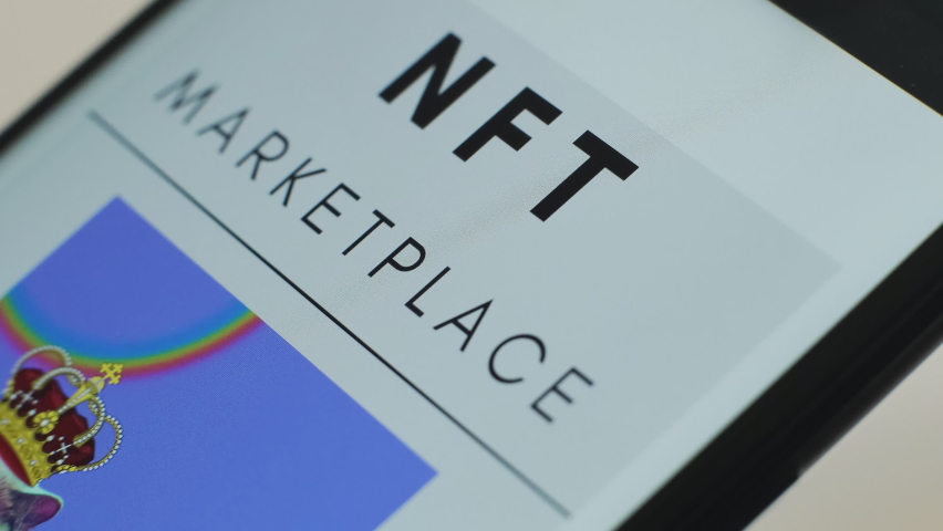 Macro Closeup of NFT Marketplace on Mobile Phone Screen. A Website For Selling and Buying Digital Art on NFT Marketplace Using non-fungible Token with Cryptographic Encryption. Blockchain Tech.  Royalty-Free Stock Footage #1090614935